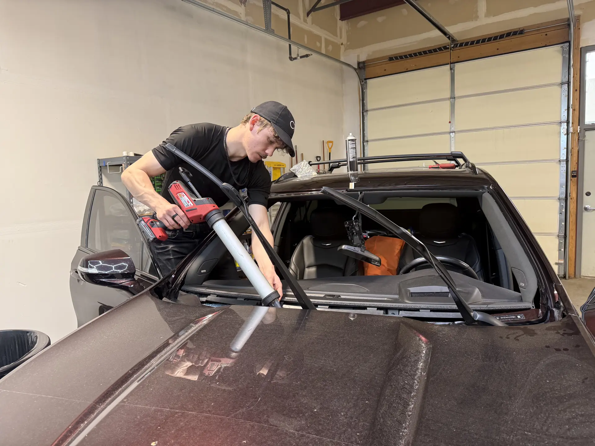 Auto glass technician installing a windshield in Carbondale, CO